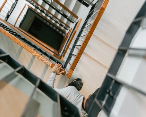 Person going down stairs carefully
